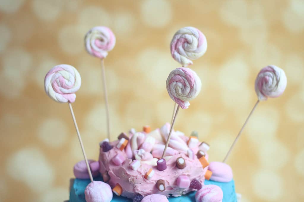 Birthday cake with marshmallow swirls on sticks