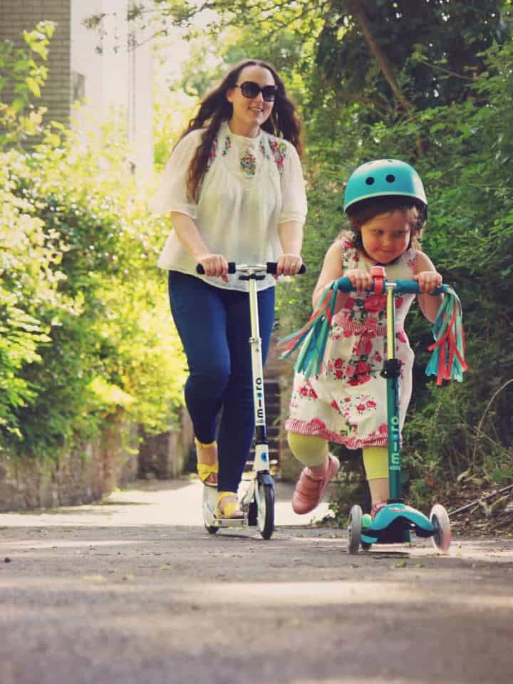 Mother and daughter riding Micro Scooters