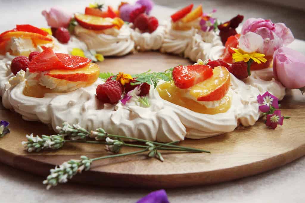 Beautifully decorated meringue wreath with edible flowers