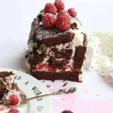 A chocolate roulade, decorated with raspberries