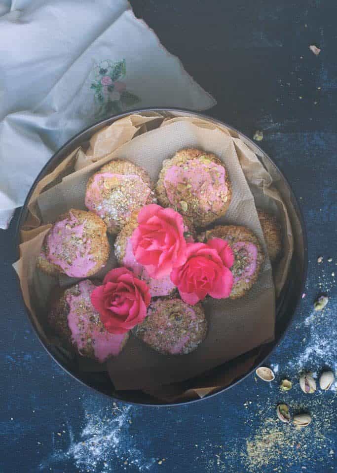 eggless coconut macaroons with rose icing and pistachios