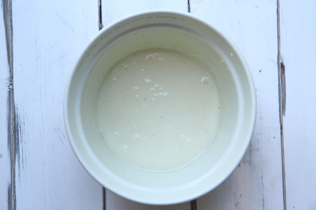 A bowl of vanilla yoghurt for coating granola bars