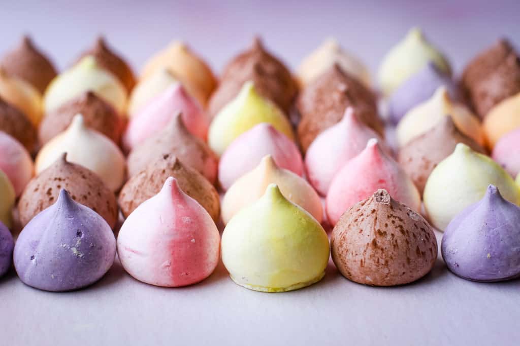 Rows of different coloured meringue drops
