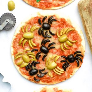 Overhead shot of a Halloween pizza with spider olives