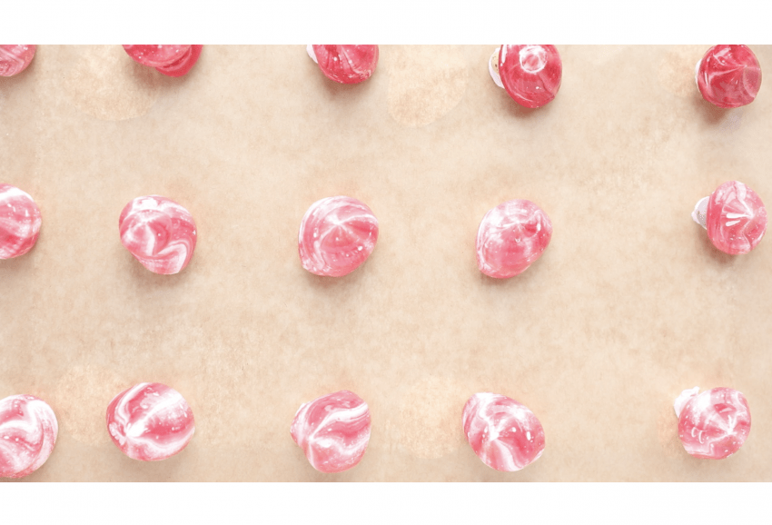 A tray of pink mini meringues