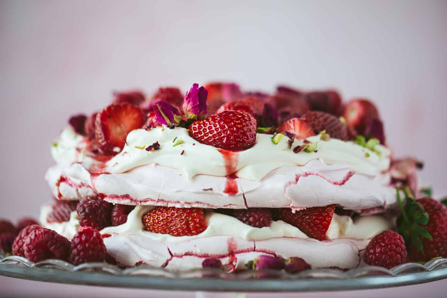 Side view of a summer berry pavlova