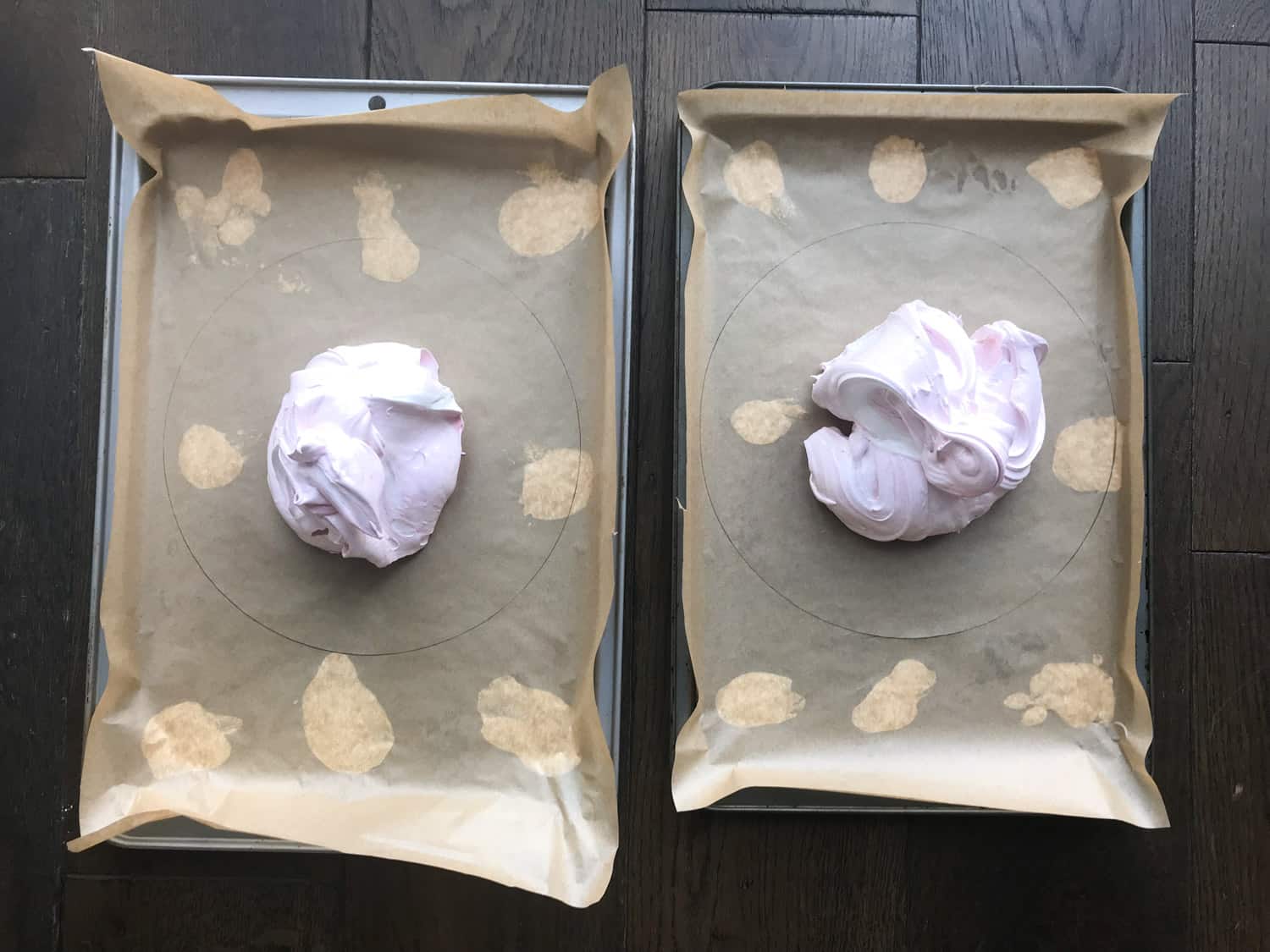 Split meringue mixture evenly between two trays