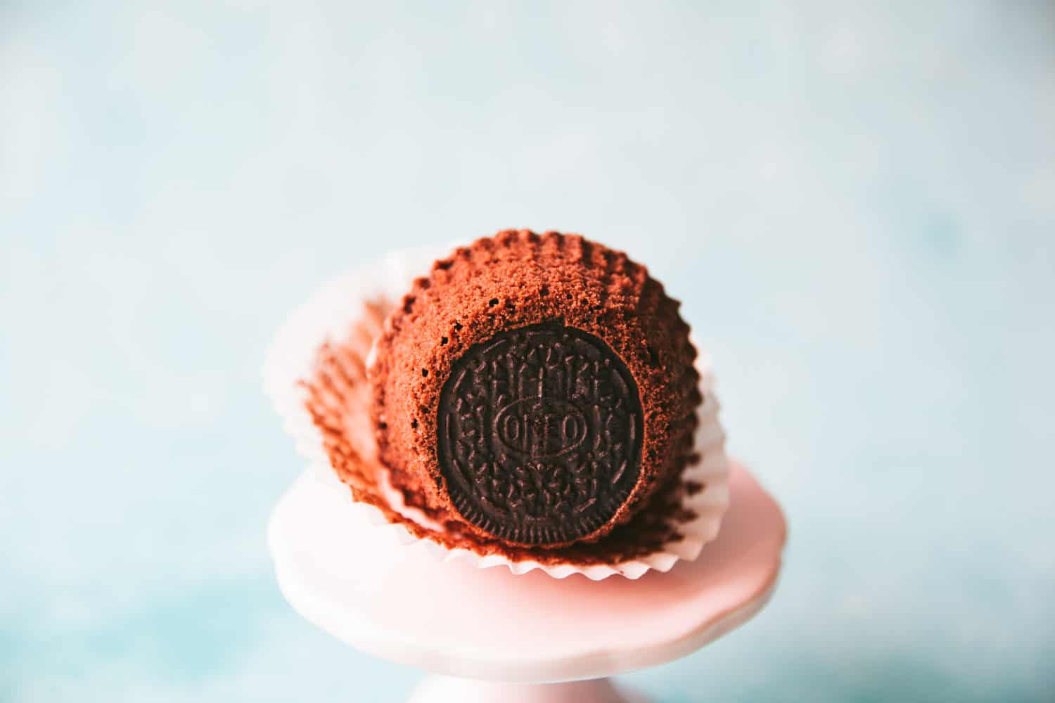 The underside of an Oreo cupcake showing the Oreo cookie