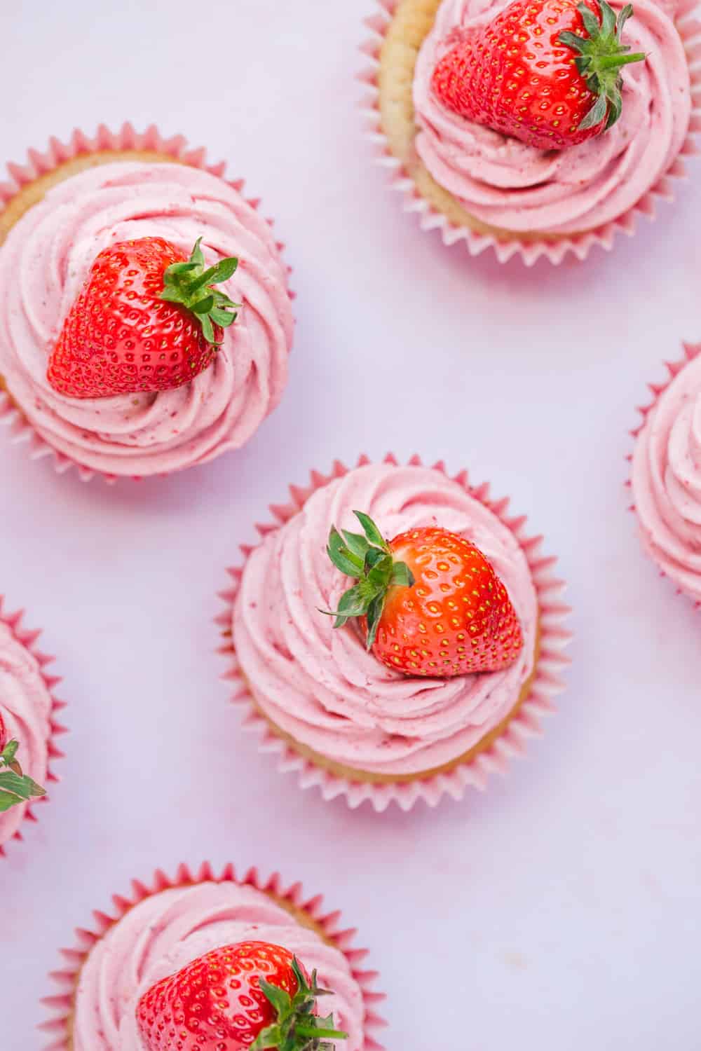 Overhead view of pink strawberry cupcakes