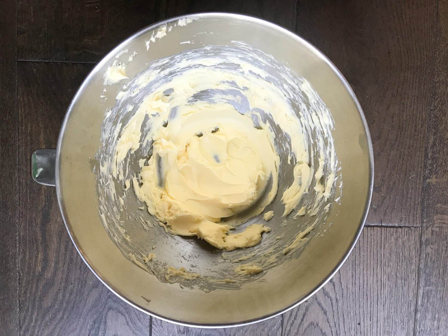 a mixing bowl with creamed butter