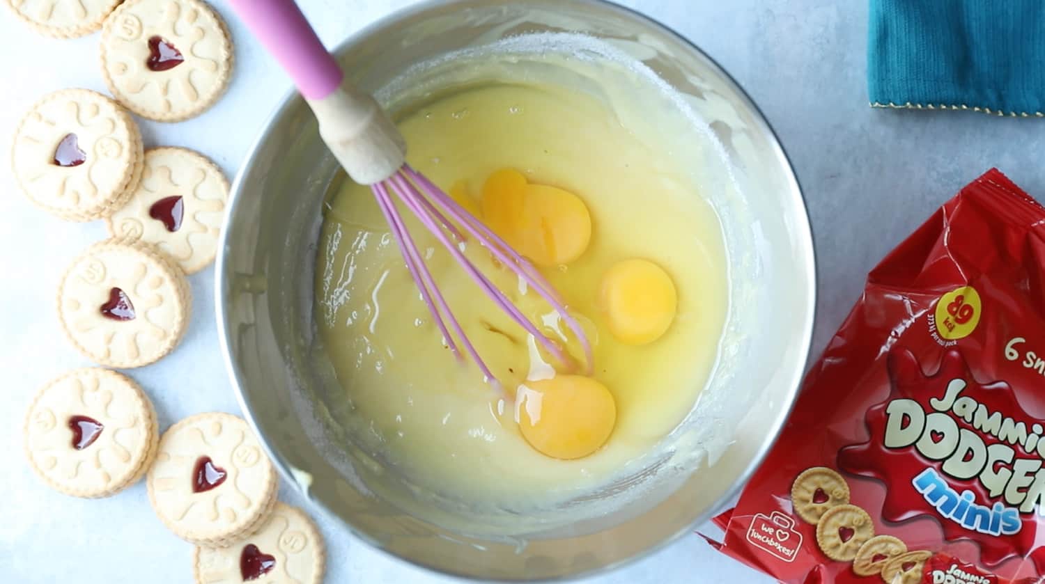 A mixing bowl with melted white chocolate, butter and 3 eggs