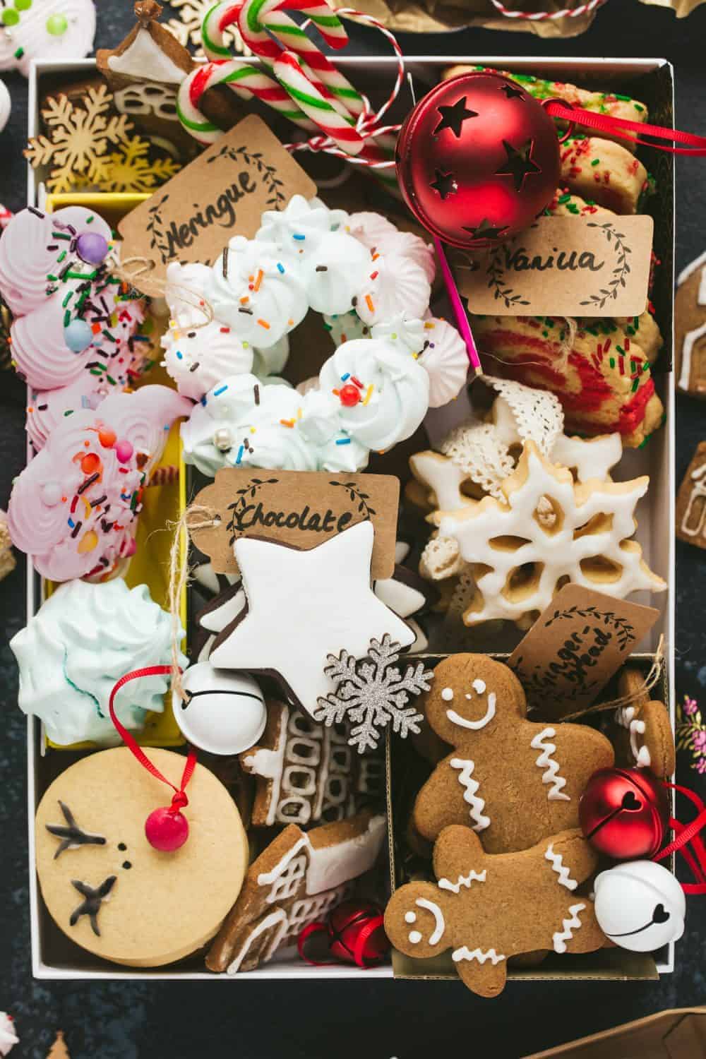 A gift box filled with homemade Christmas cookies and biscuits. 