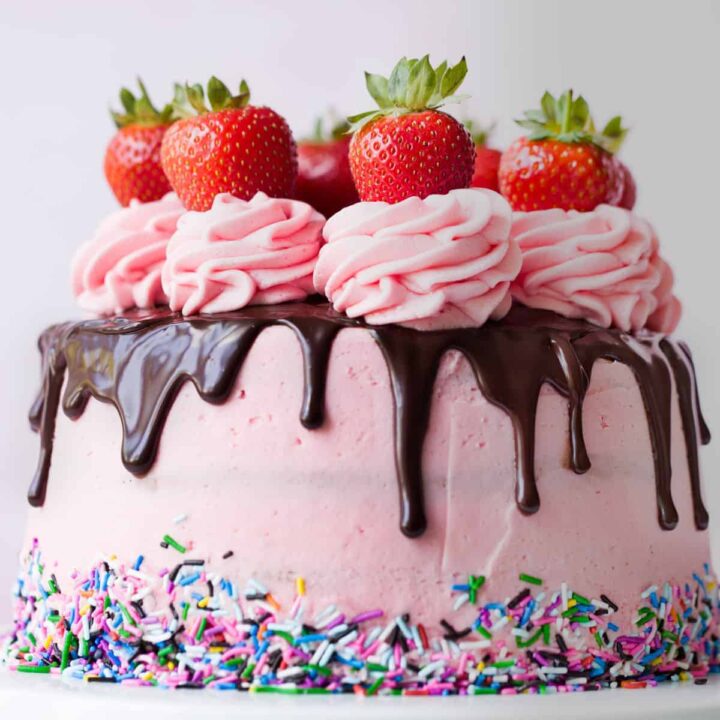 Close up of a strawberry drip cake