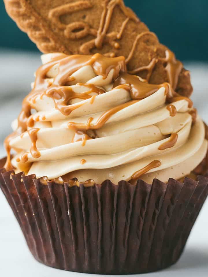 A vanilla cupcake topped with a Lotus biscoff swiss meringue buttercream and drizzled with warm biscoff spread.