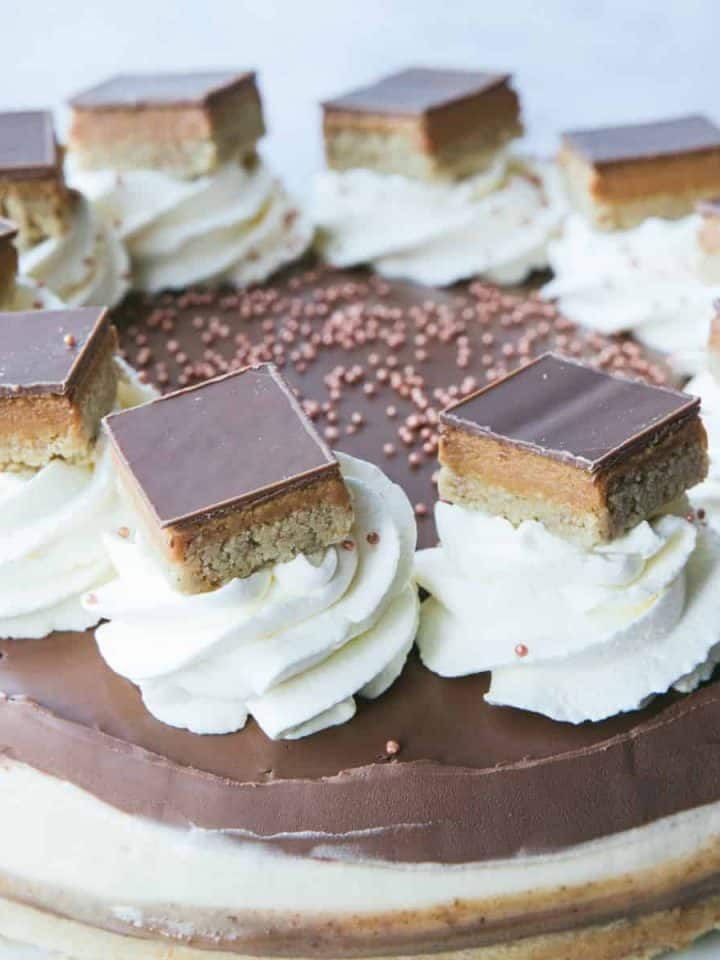 A Millionaire's Cheesecake with slices of Millionaire shortbread on top.