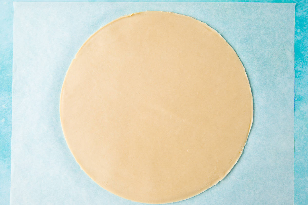 A circle of unbaked shortbread. 