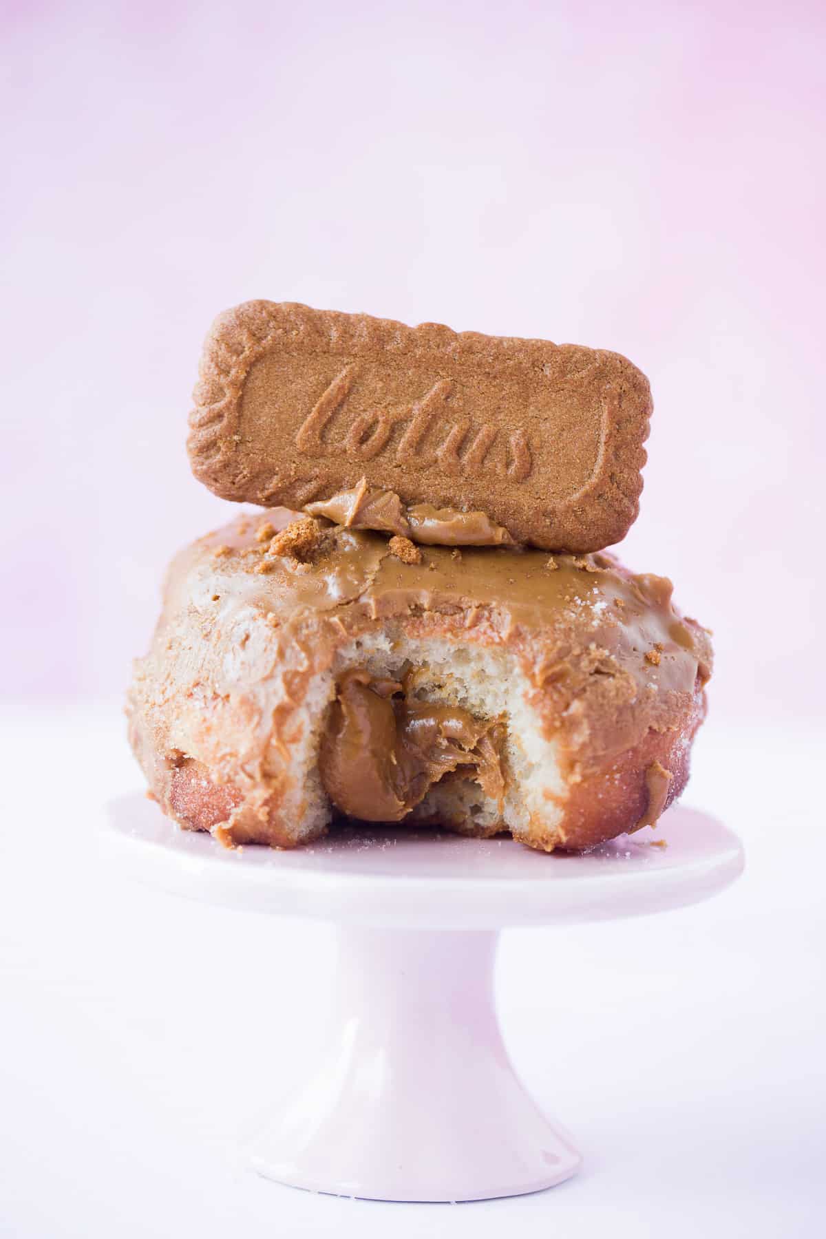 A single homemade doughnut with a Lotus biscoff filling and a cookie on top. 