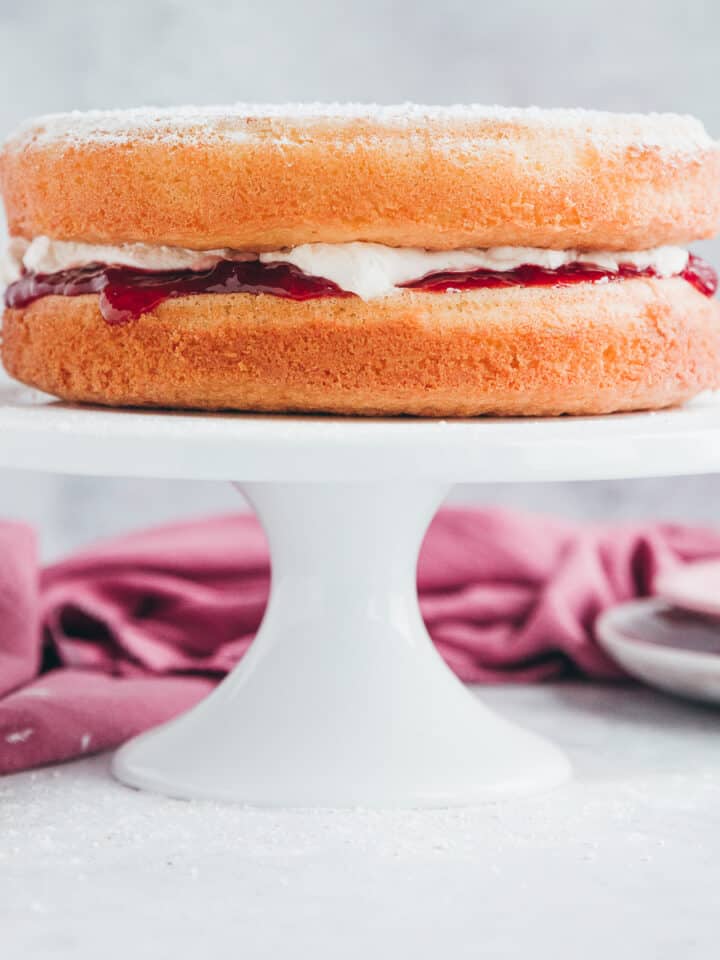 A victoria sponge with a fresh cream and strawberry jam filling.