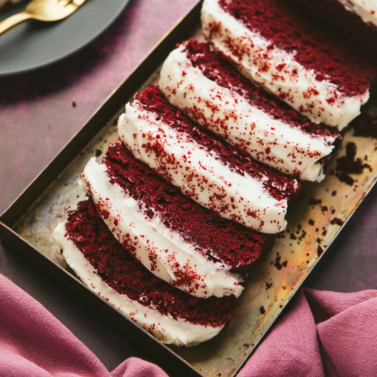 Red Velvet Loaf Cake cut into slices.