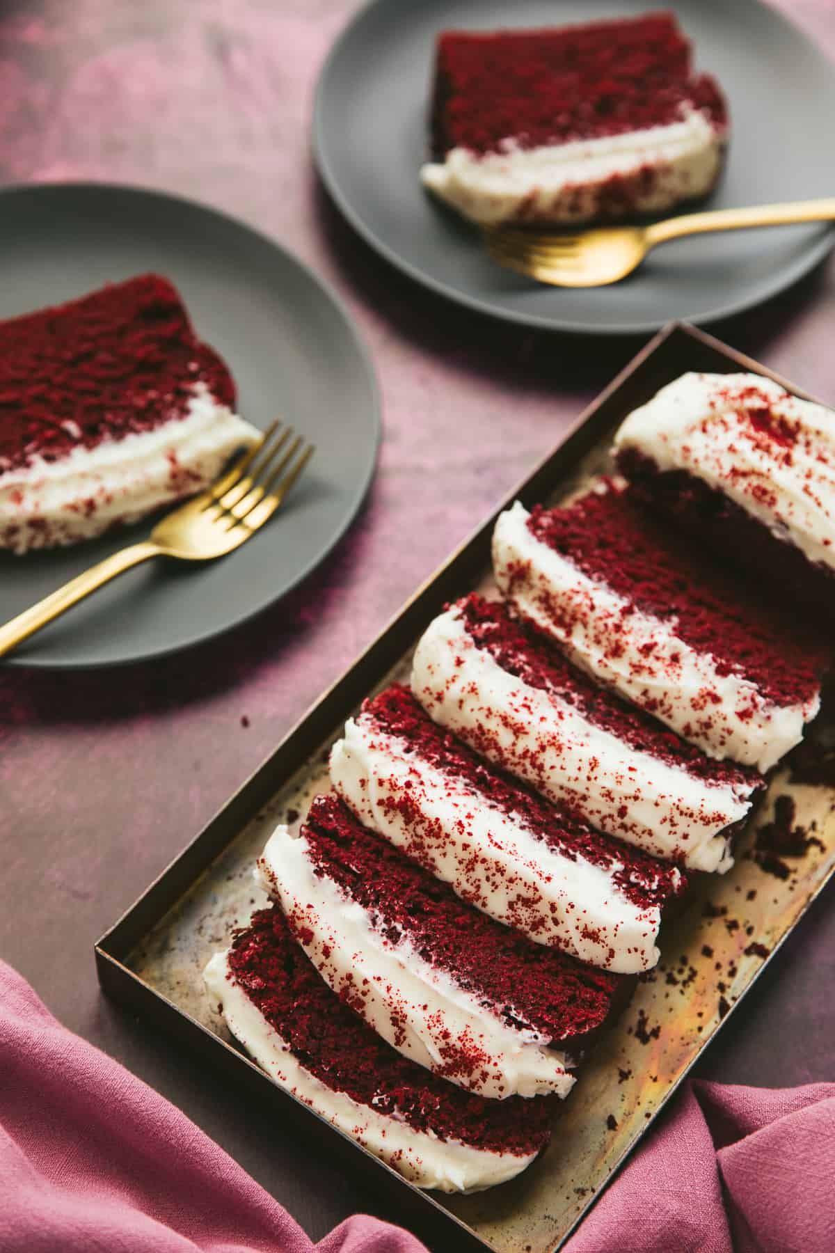 Red Velvet Cake sliced and on a metal tray. 