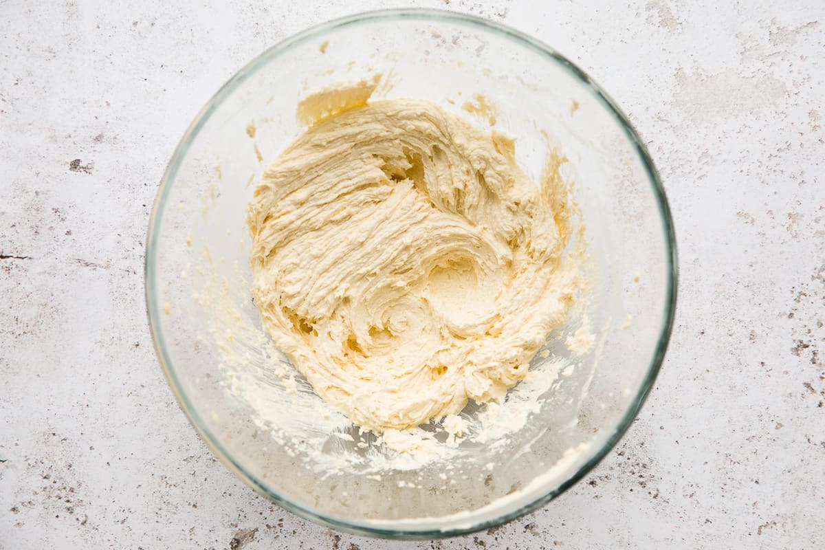 A mixing bowl filled with Stork baking margarine and golden caster sugar that has been creamed together. 