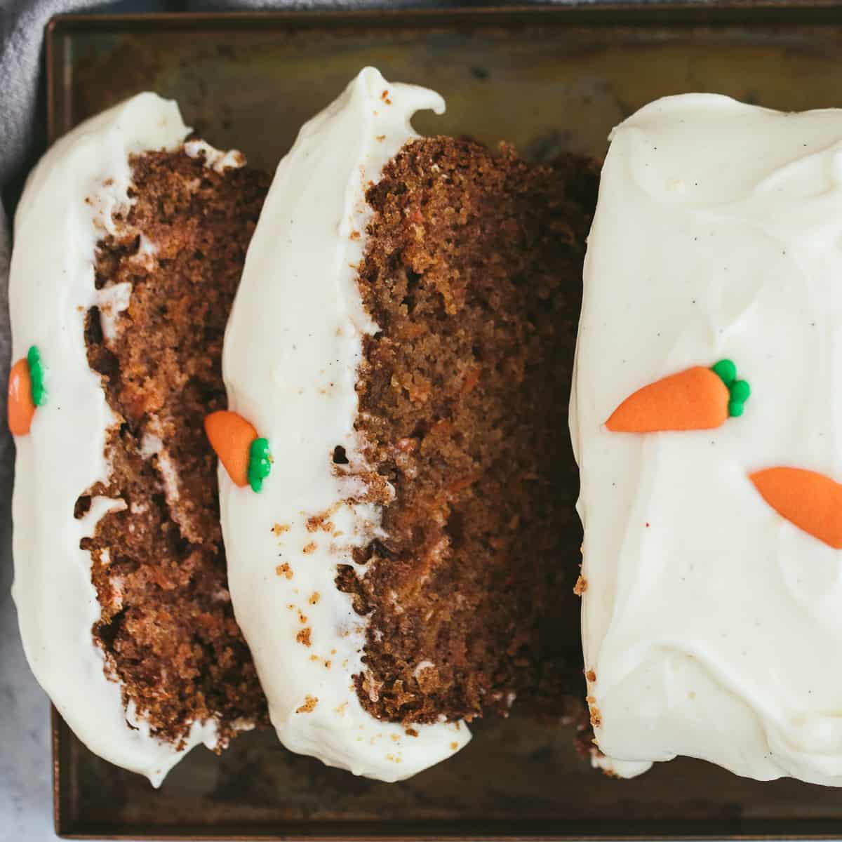 A carrot cake loaf that has been sliced.