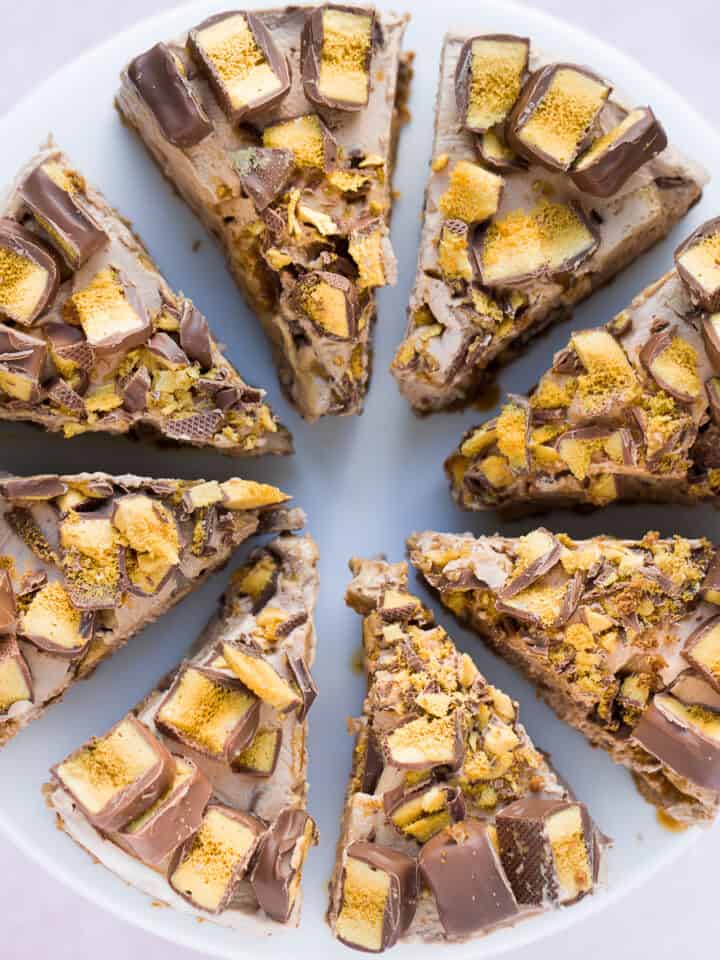 A no bake Crunchie Cheesecake cut into 8 individual pieces.