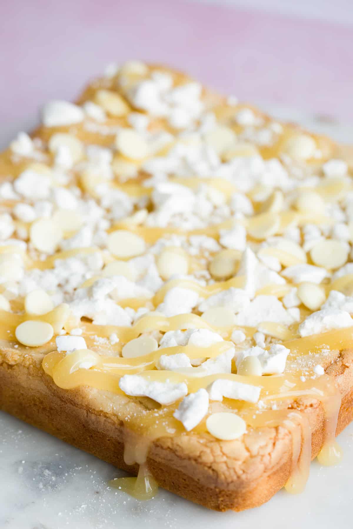 A slab of blondies decorated with lemon drizzle. 
