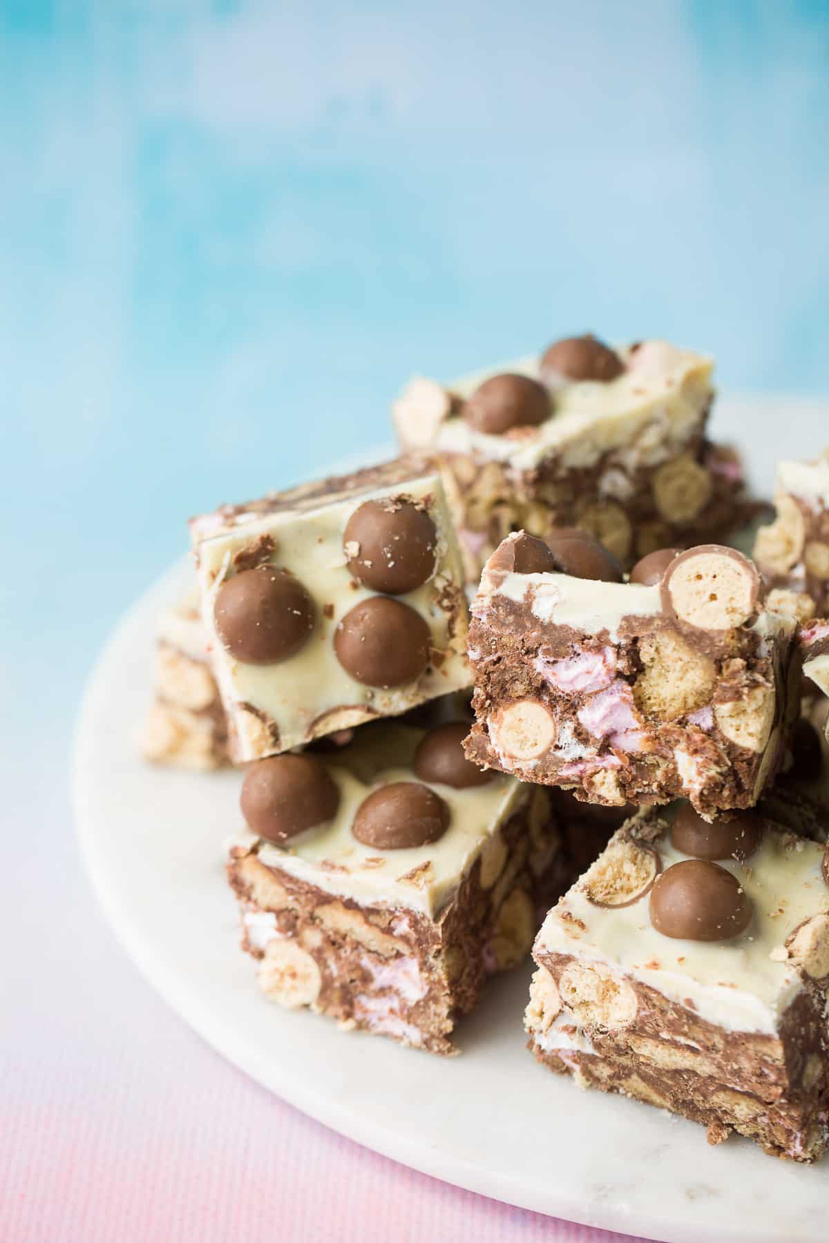 No bake Maltesers Rocky Road with mini marshmallows and chunks of malt biscuits. They are coated with white chocolate. 